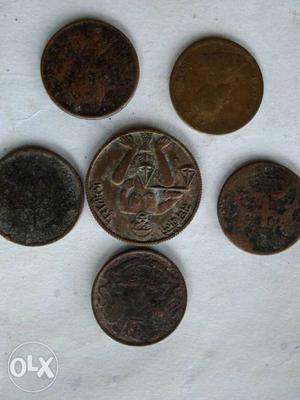 Six Round Brown Coins