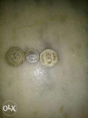 Three Silver And Gold Coins