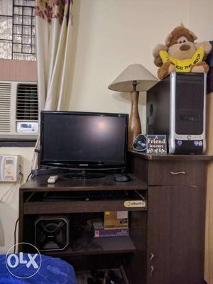 Black Computer Tower With Flat Screen Computer Monitor