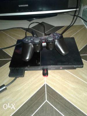 Black Sony PS2 Game Console With Game Controller