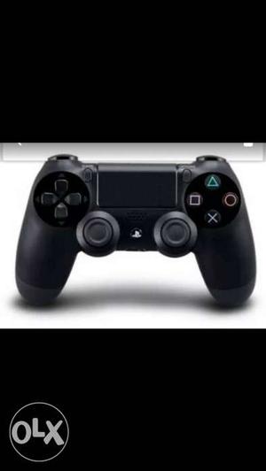 Black Sony PS4 Controller along with fifa 16