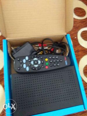 Black Tata Sky Set-top Box With Black Remote And Box