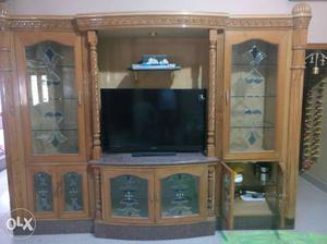 Brown Wooden Entertainment Center And Black Flat Screen TV