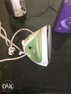 Green And White Clothes Iron