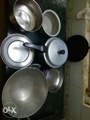 Kitchen items- cooker, 6plates, kadaahi, and two
