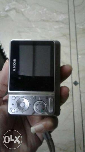 Silver And Black Sony Digital Camera