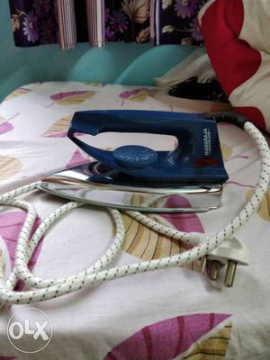 Silver And Blue Clothes Iron