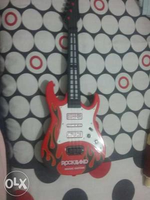 Red And White Rock Band Guitar in very good condition