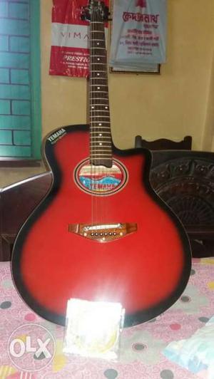 Red Bust Cutaway Acoustic Guitar