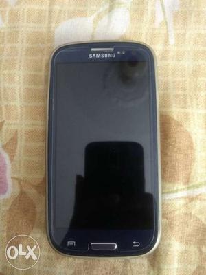 Samsung Galaxy S3 with charger and jelly cover.