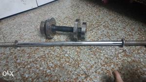Gray Metal Barbell Rod And Gray Adjustable Dumbbell