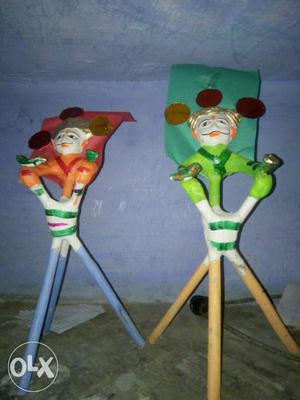 Two Orange And Green Wooden Toys