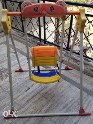 Baby's Orange, Red, And Yellow Mobile Swing