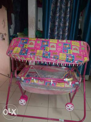 Baby's Pink Steel Rocking Crib