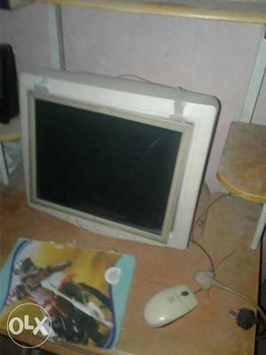 Beige CRT Computer Monitor And Computer Mouse