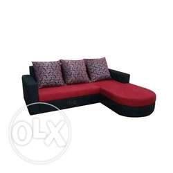 Black And Red Sectional Sofa With Three Gray Throw Pillows
