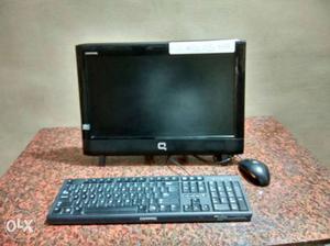 Black Compaq Computer Monitor And Computer Keyboard
