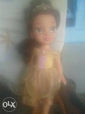 Black Haired Girl Wearing Yellow Dress Plastic Doll