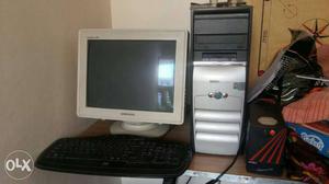 White Samsung CRT Computer Monitor With Gray Computer Tower