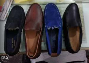 Four paired Black, Blue, And Brown Loafer Shoes