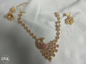 Gold-colored Bib Necklace And Pair Of Earrings