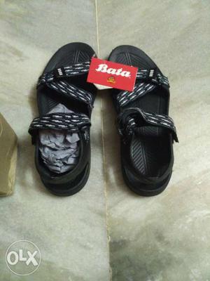 Pair Of Blacl-and-gray Bata Sandals