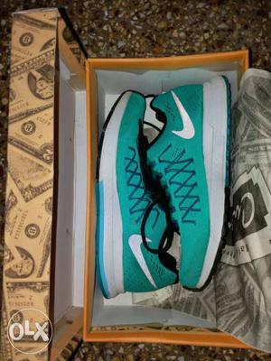 Teal-and-white Nike Running Shoes