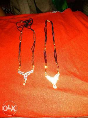 Two Gold-colored Necklaces