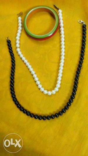 Two White And Black Round Beaded Necklaces