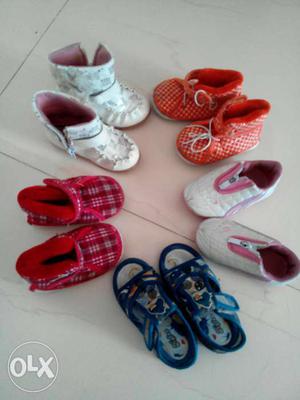 Toddler's Five Pairs Of Orange, Blue, Red And White Shoes