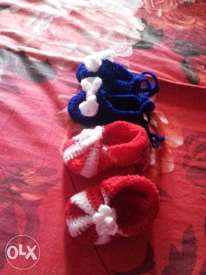 Two Pairs Of Knitted Blue And Red Shoes