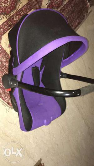 Baby's Black And Purple Car Seat