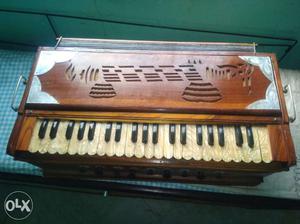 Brown Wooden Base Upright Piano