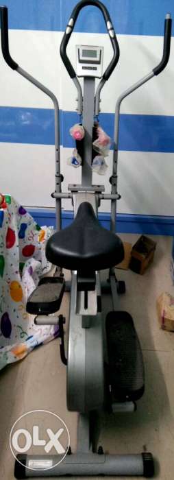 Elliptical cross trainer with magnetic Drum