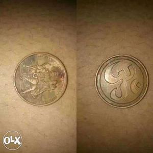 One copper Round coins with God om symbol one side nd