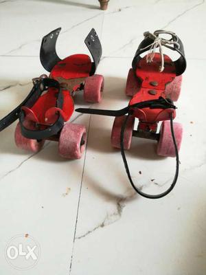 Pair Of Red Roller Blades