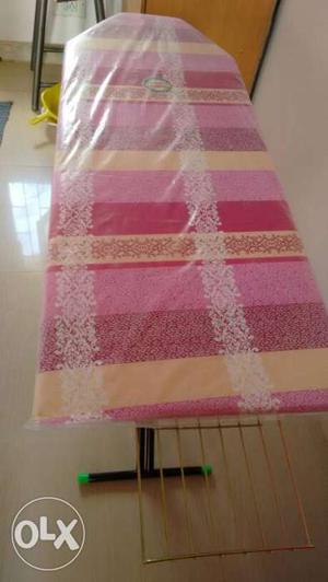 Pink, White, And Beige Striped Ironing Board