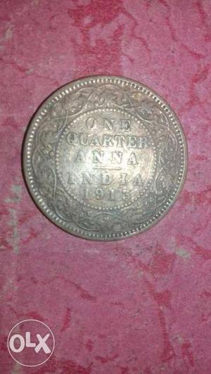 Round Silver-colored One Quarter Anna Coin