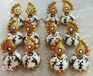 Six Pairs Of White-black-and-gold-colored Jhumka Earrings
