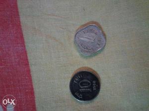 Two Black And Silver-colored Coins