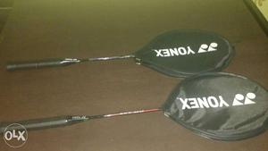 Two Red-and-black Yonex Badminton Rackets