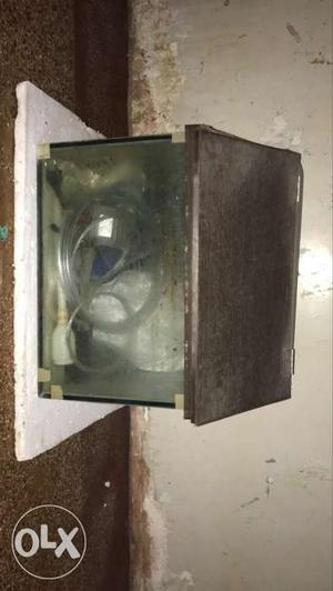 Fish tank with cover attached tubelight socket