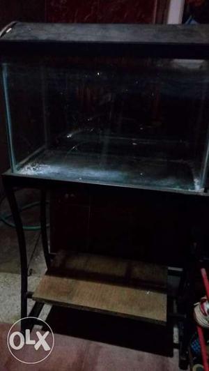 Standard size aquarium with small crack, stand,