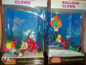 Two Balloon Clown Toys In Boxes