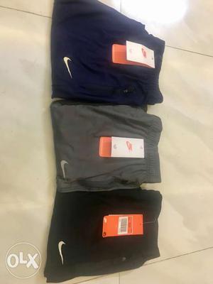 Blue, Gray, And Black Nike Pants