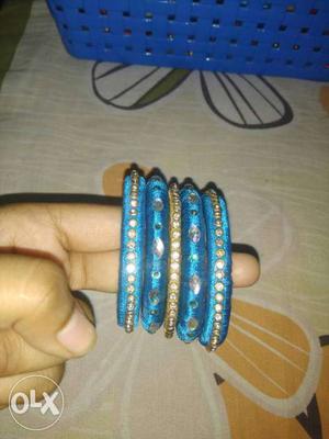 Four Blue And Gold-colored Silk Thread Bangles