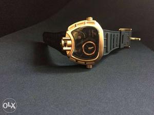 Gold-colored Bezel Hublot Chronograph Watch With Black Band