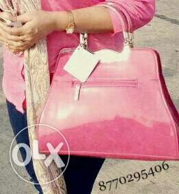 New condition handbag.pink color.two month old.