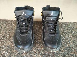 Pair Of Black Air Jordan 12's