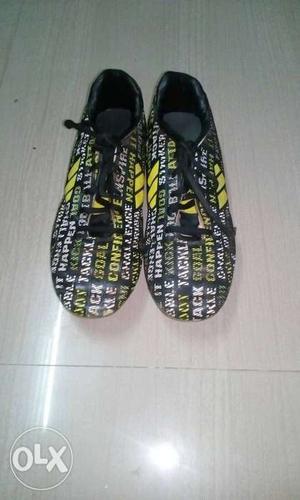 Pair Of Black-and-yellow Word Printed Sneaker